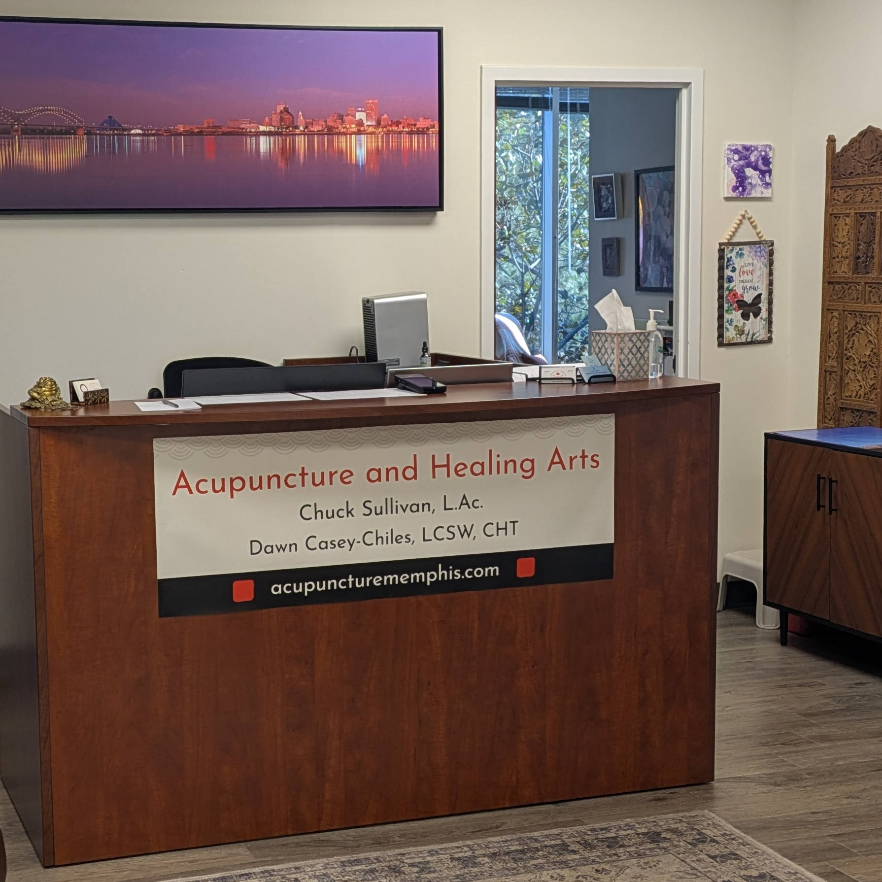 Reception desk with a picture of a bridge in the background